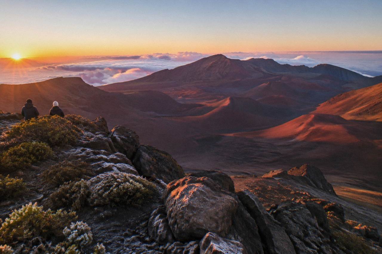 Sunrise light filling the bowl of Haleakala Crater seen from a high overlook