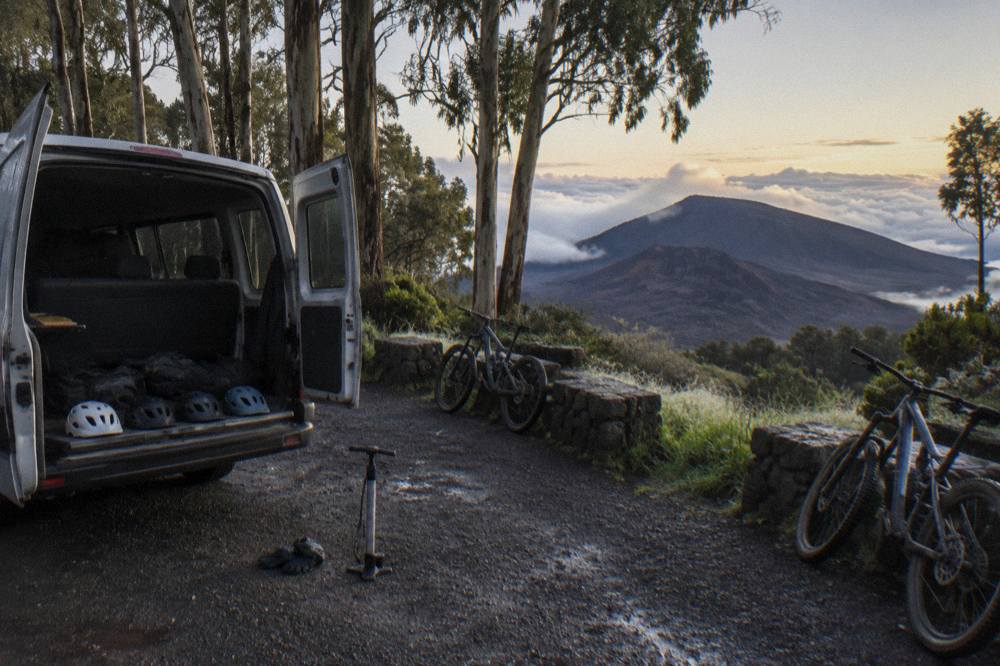 Bicycles lined up beside a van at a pullout on the Haleakala crater road