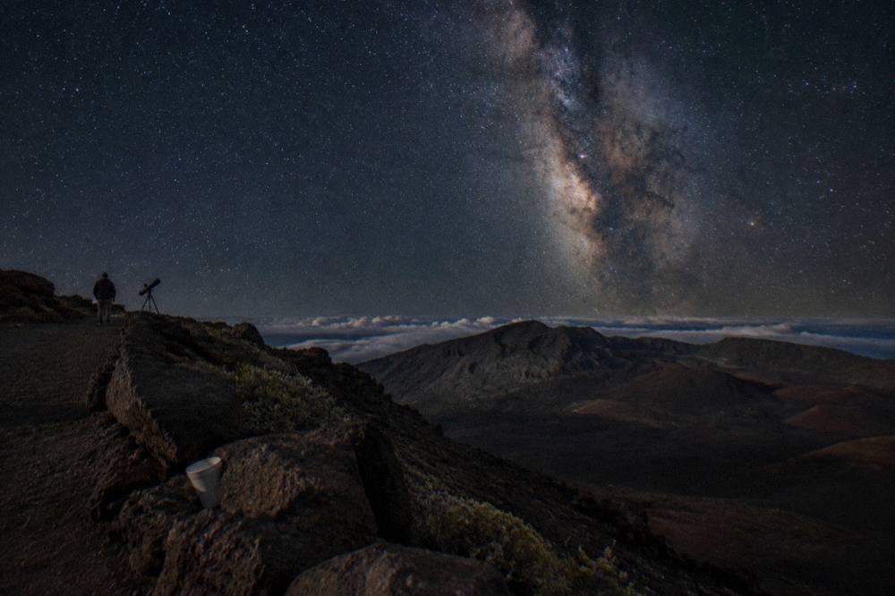 Milky Way rising over Haleakala summit with a silhouette of a telescope