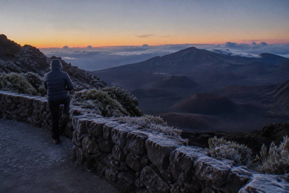 A quiet crater overlook at dusk with cinder cones in shadow