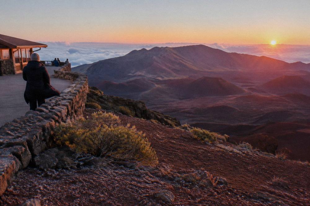 Sunrise light filling the Haleakala crater with shadowed cinder cones
