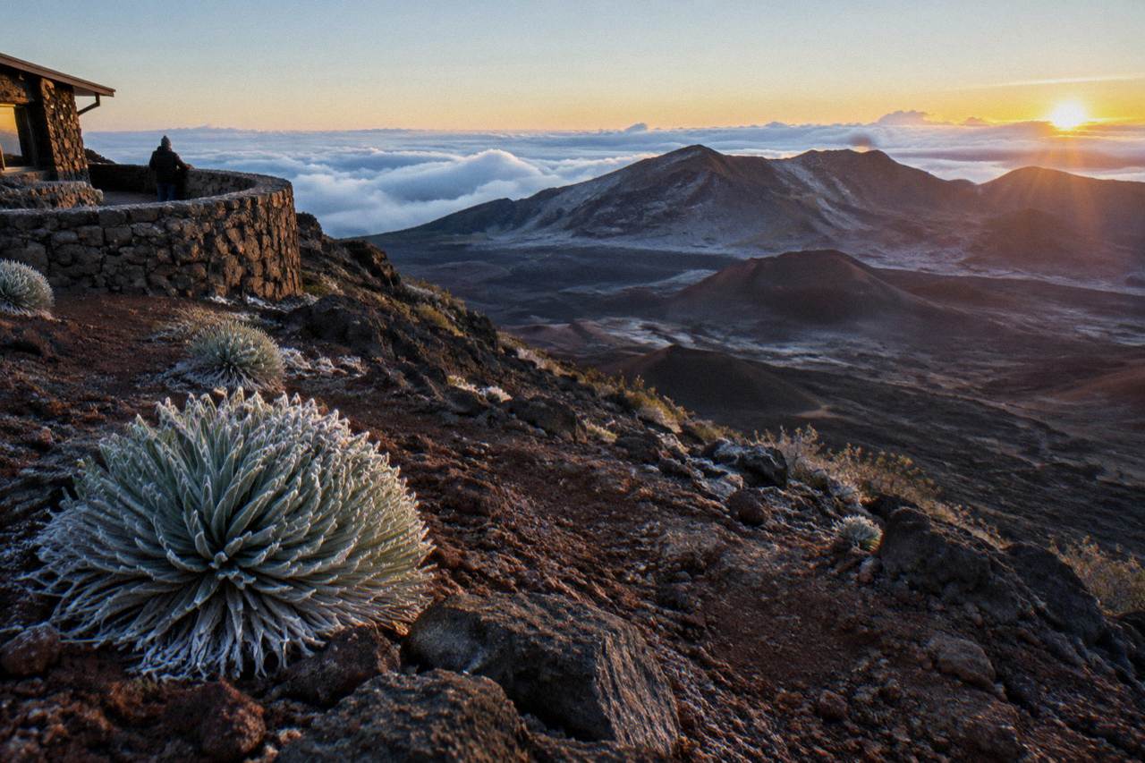 First light crossing the Haleakala crater floor seen from a summit overlook