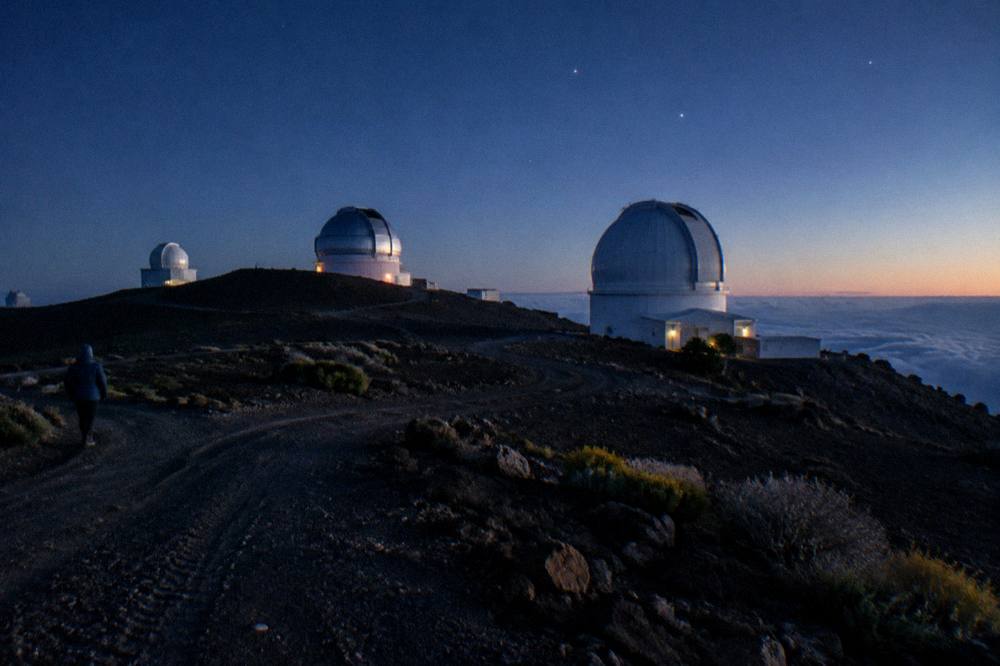 Stars appearing over the Haleakala summit observatories after sunset
