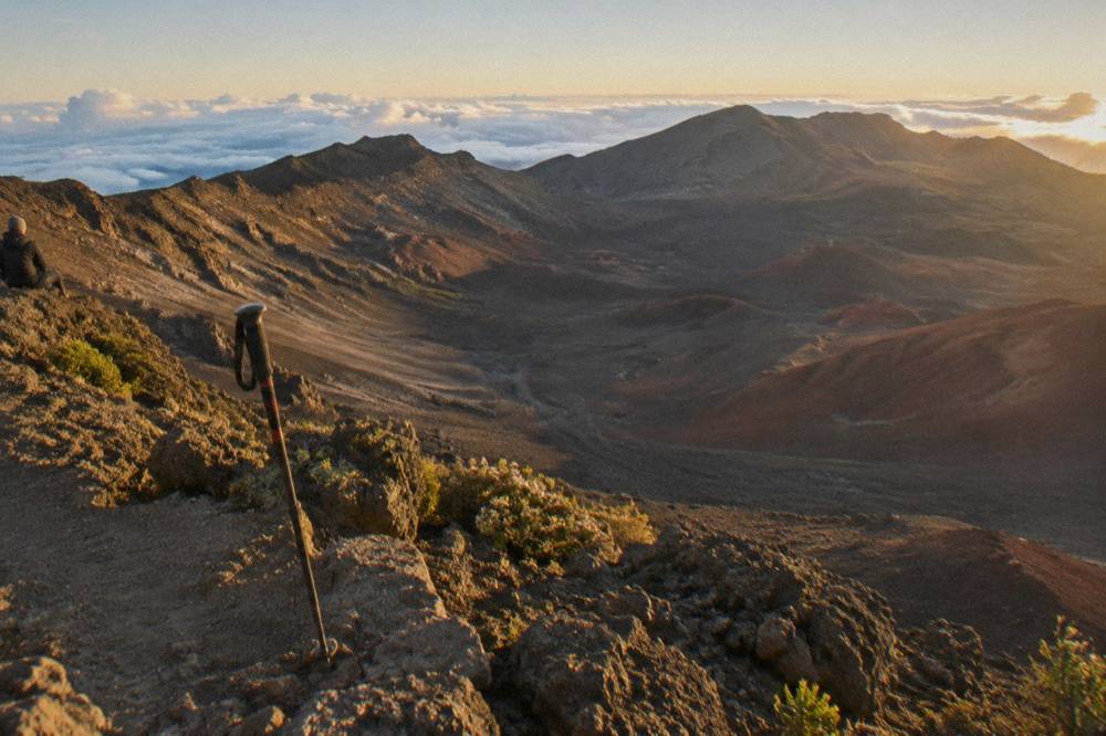 Golden late afternoon light across a cinder desert inside the crater