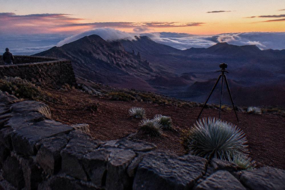 A quiet overlook at dusk with the crater floor fading into shadow