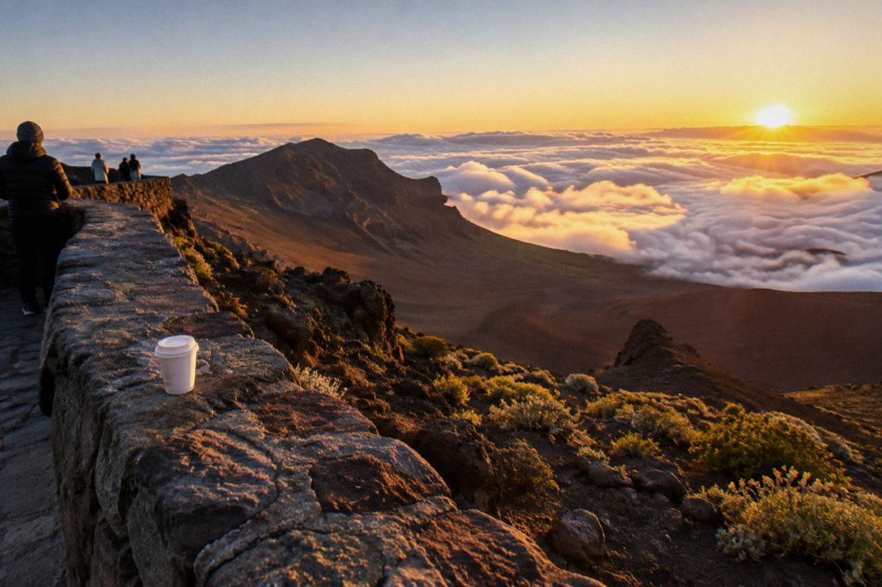 Sunrise light filling the Haleakala crater above a sea of clouds